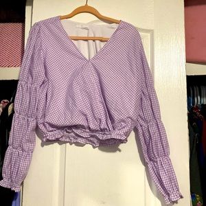 Purple top hasn’t been worn is super cute size medium